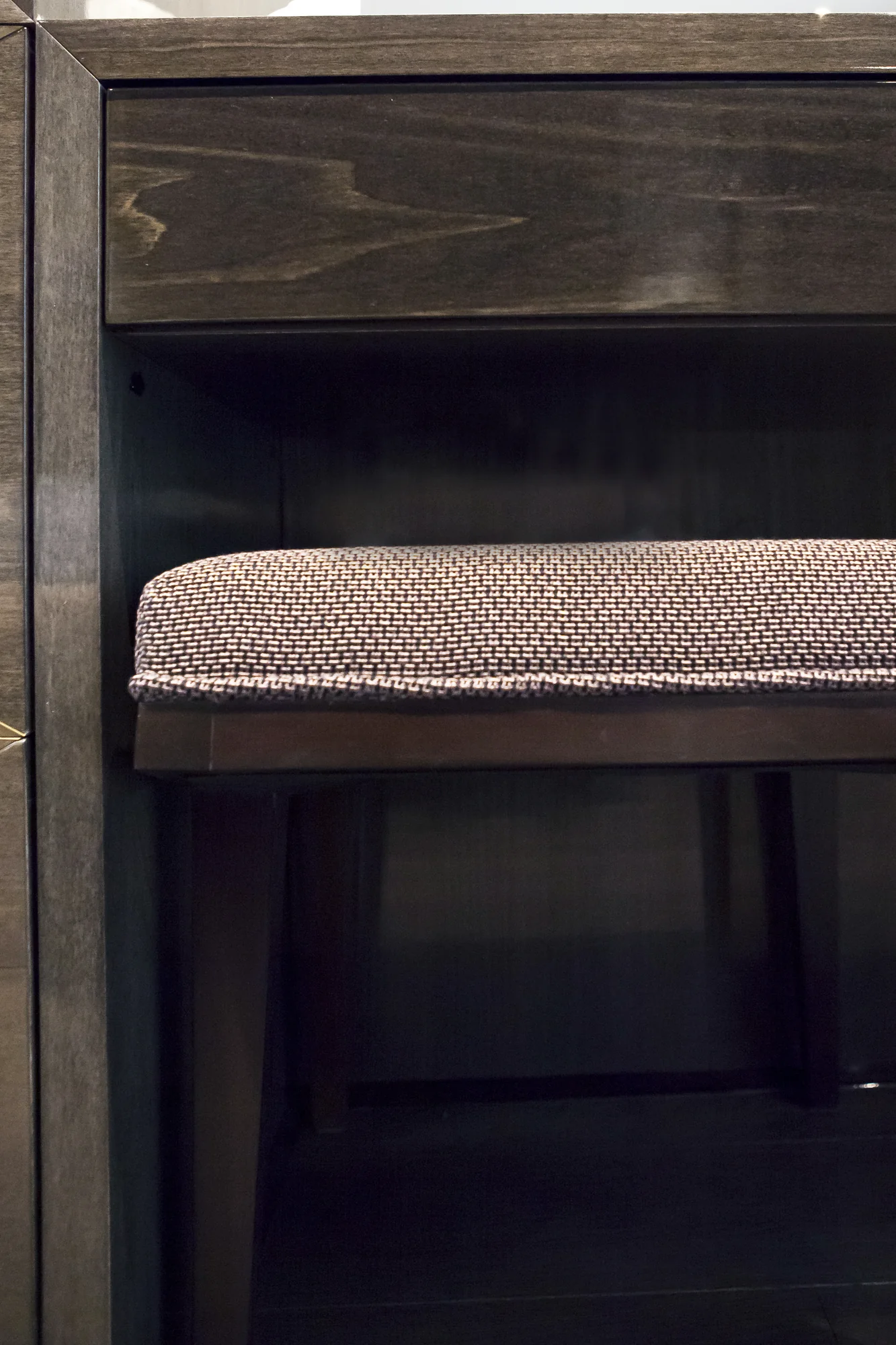 Stool tucked beneath the fitted dressing table