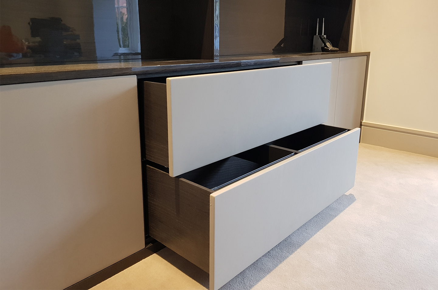 Open drawers below the bookcase