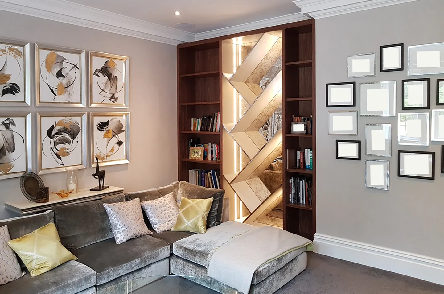 Room view of natural walnut fitted bookcase with illuminated geometric mirror feature