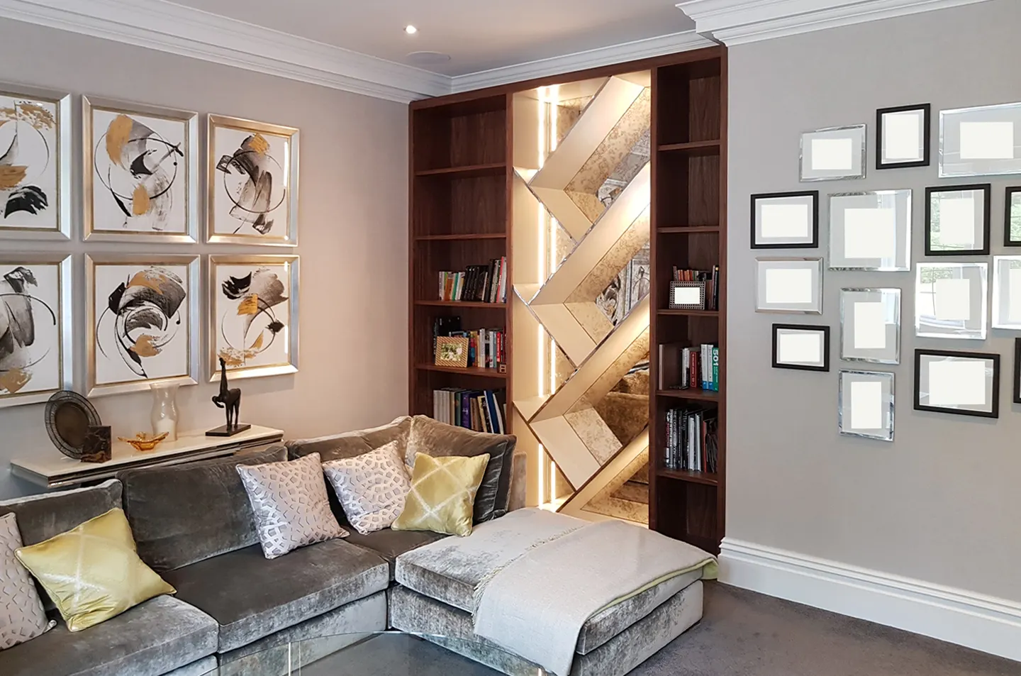 Walnut bookcase and illuminated mirror feature beside the living-room sofa