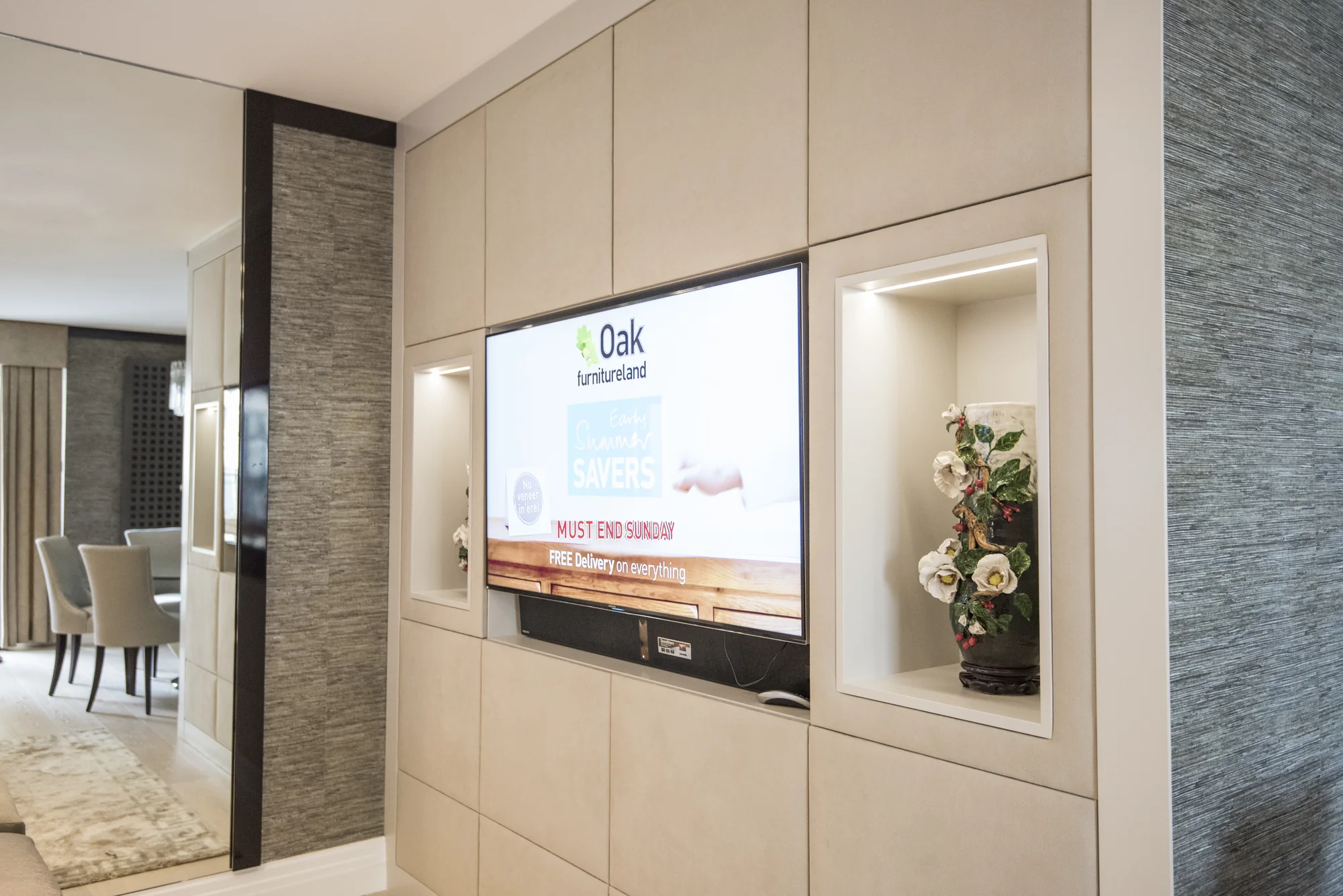 Side room view of cream media furniture