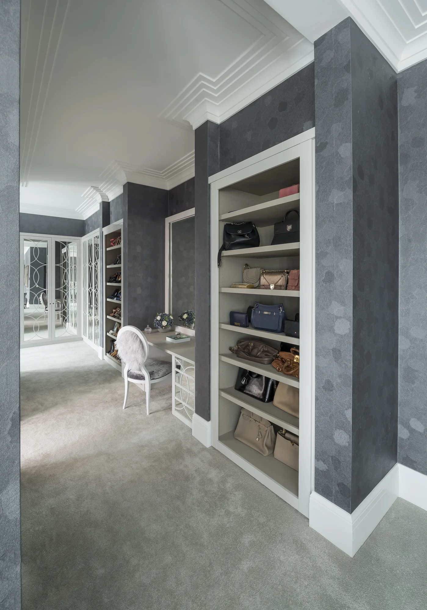 Open fitted shoe shelving along the dressing-room passage
