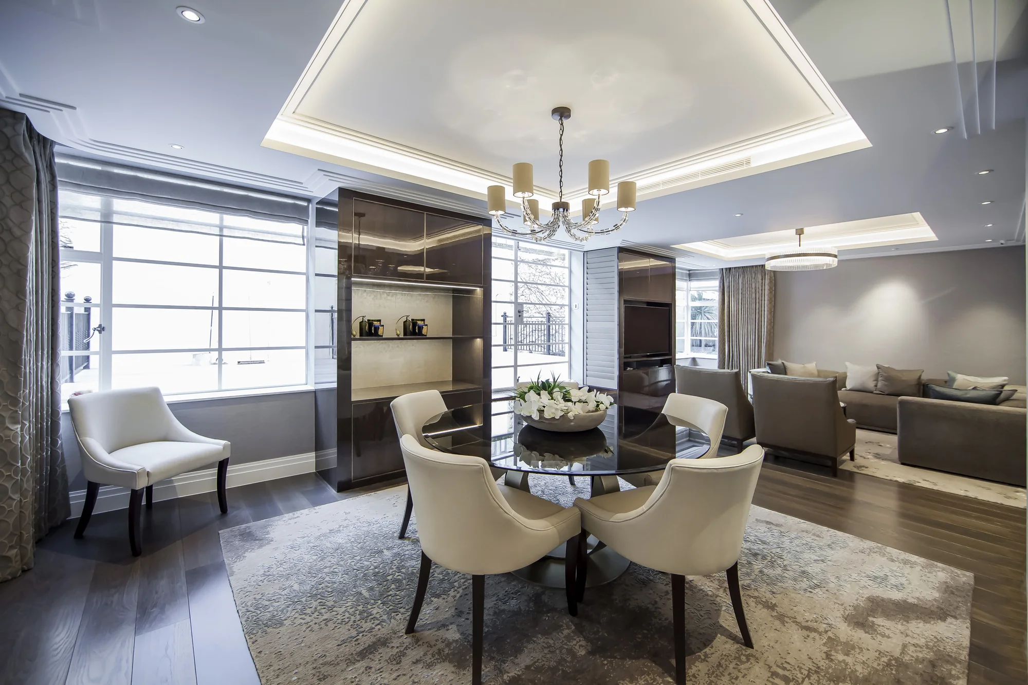 Full dining-room view with tall fitted display cabinetry