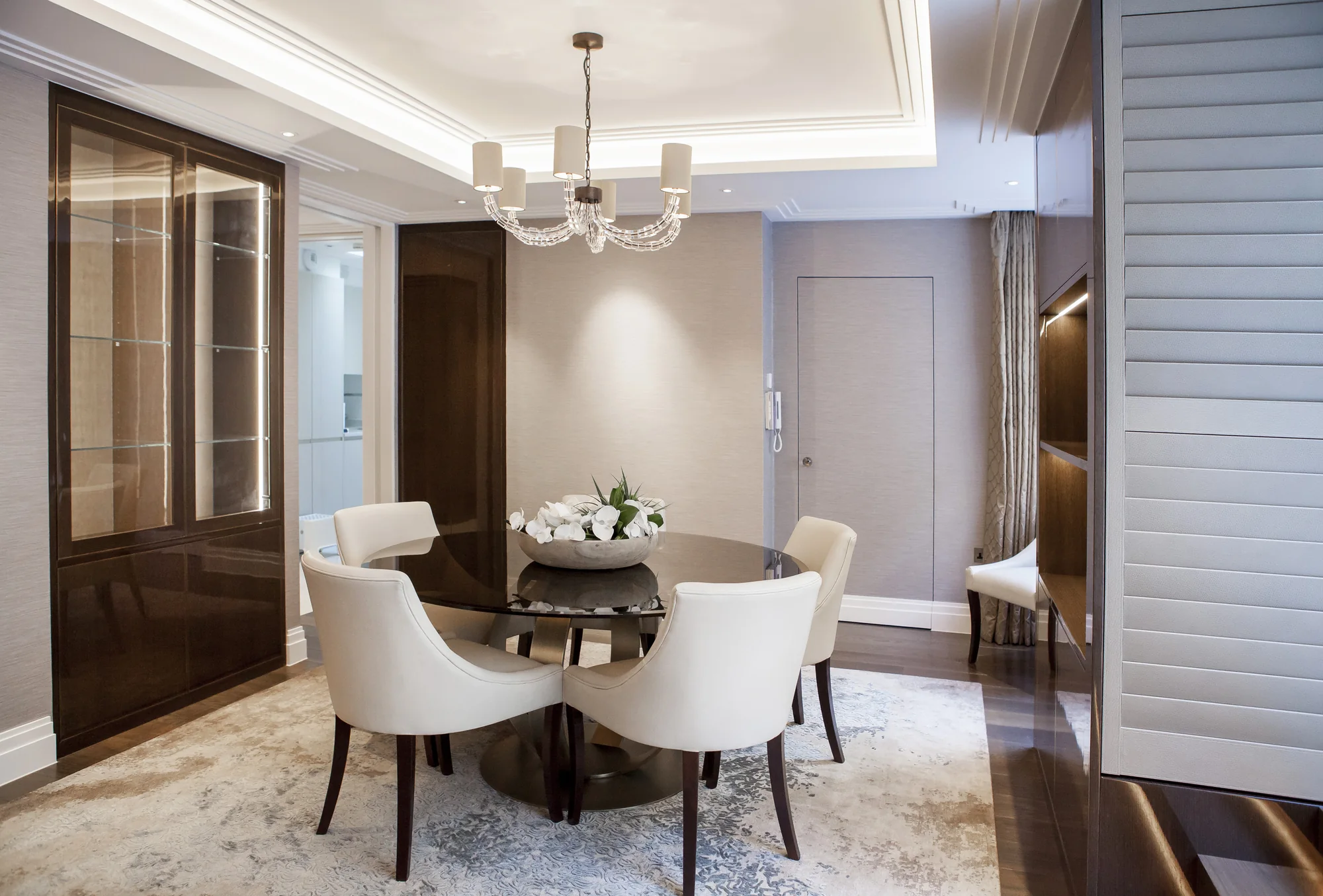 Closed glossy dining storage beside the table