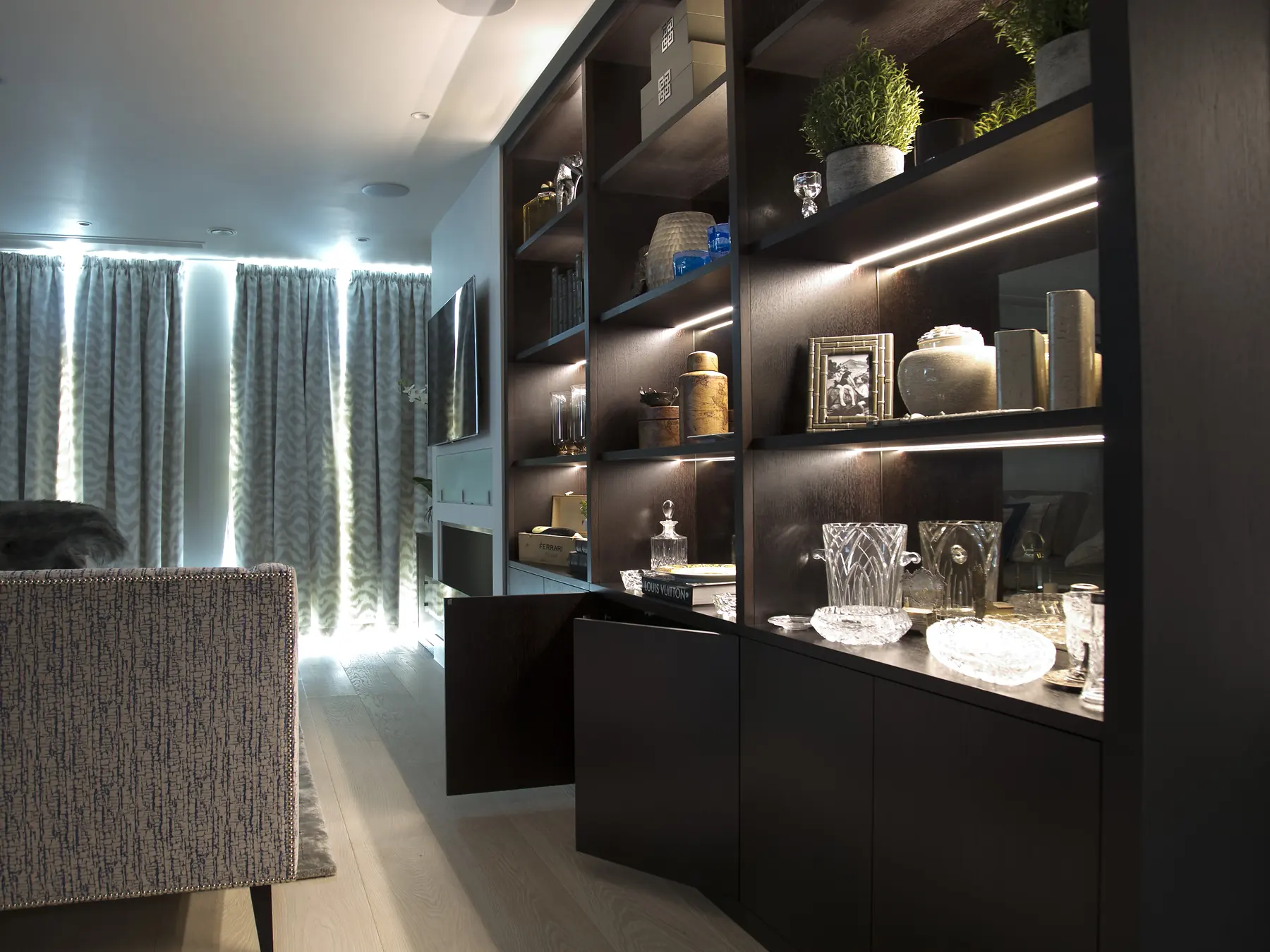 Angled illuminated view of bookcase