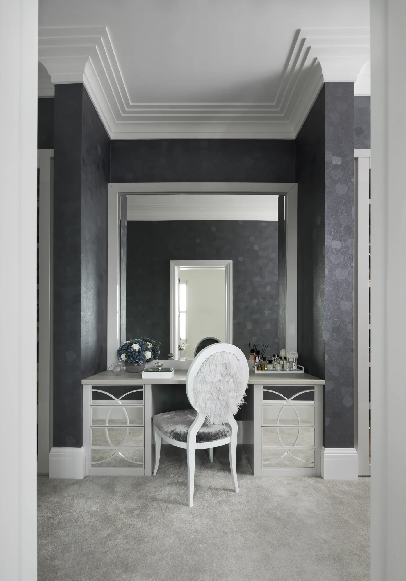 Complete make-up table viewed through the doorway, with twin drawer units and a tall mirror