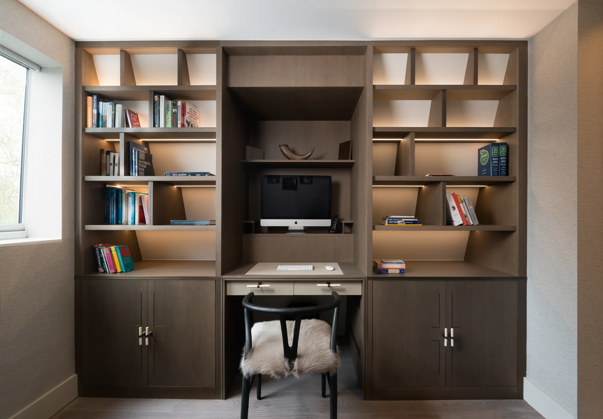 Full front view of the fitted desk, shelving and cupboards