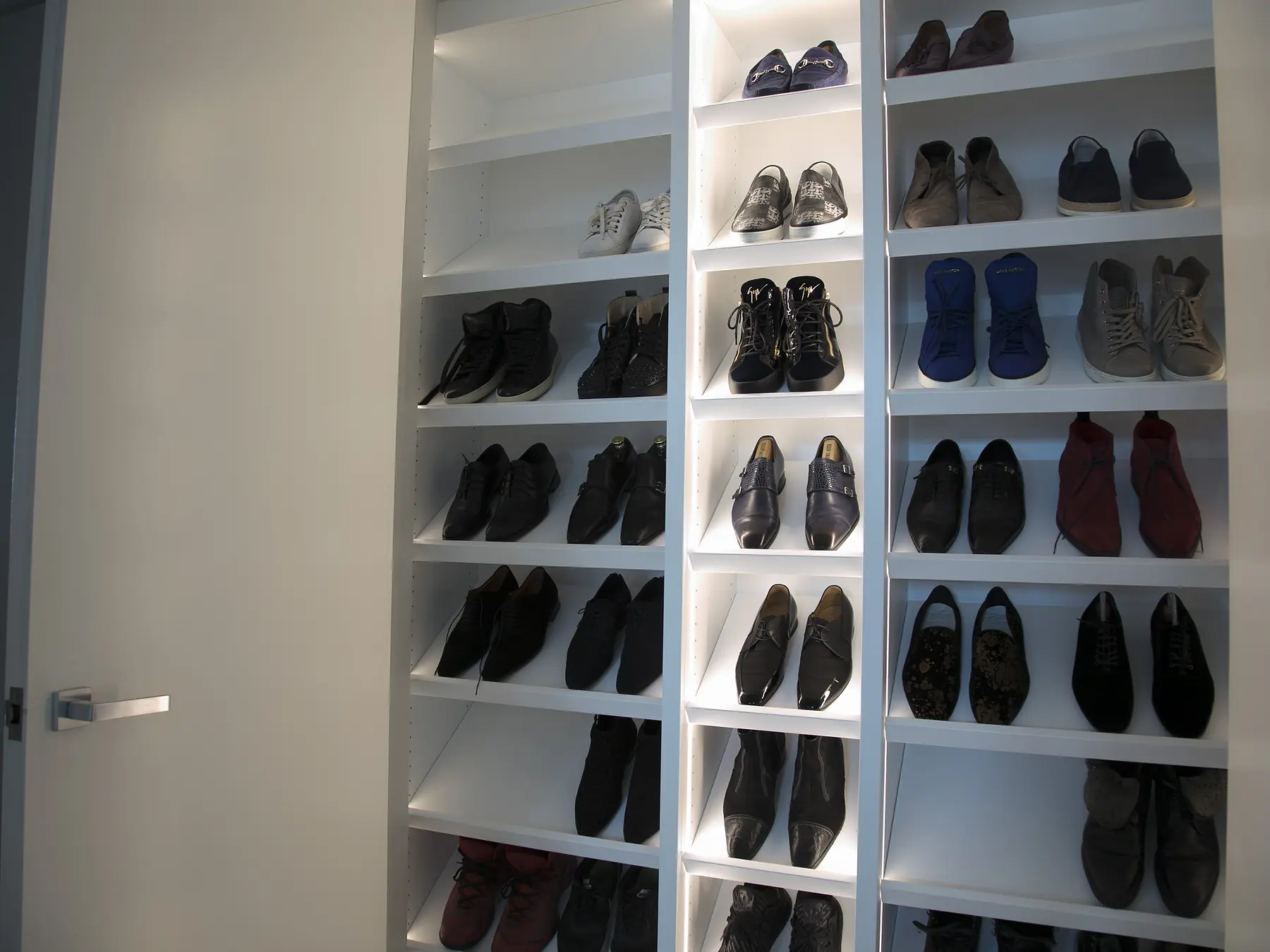 Angled view of shoe-storage cabinetry