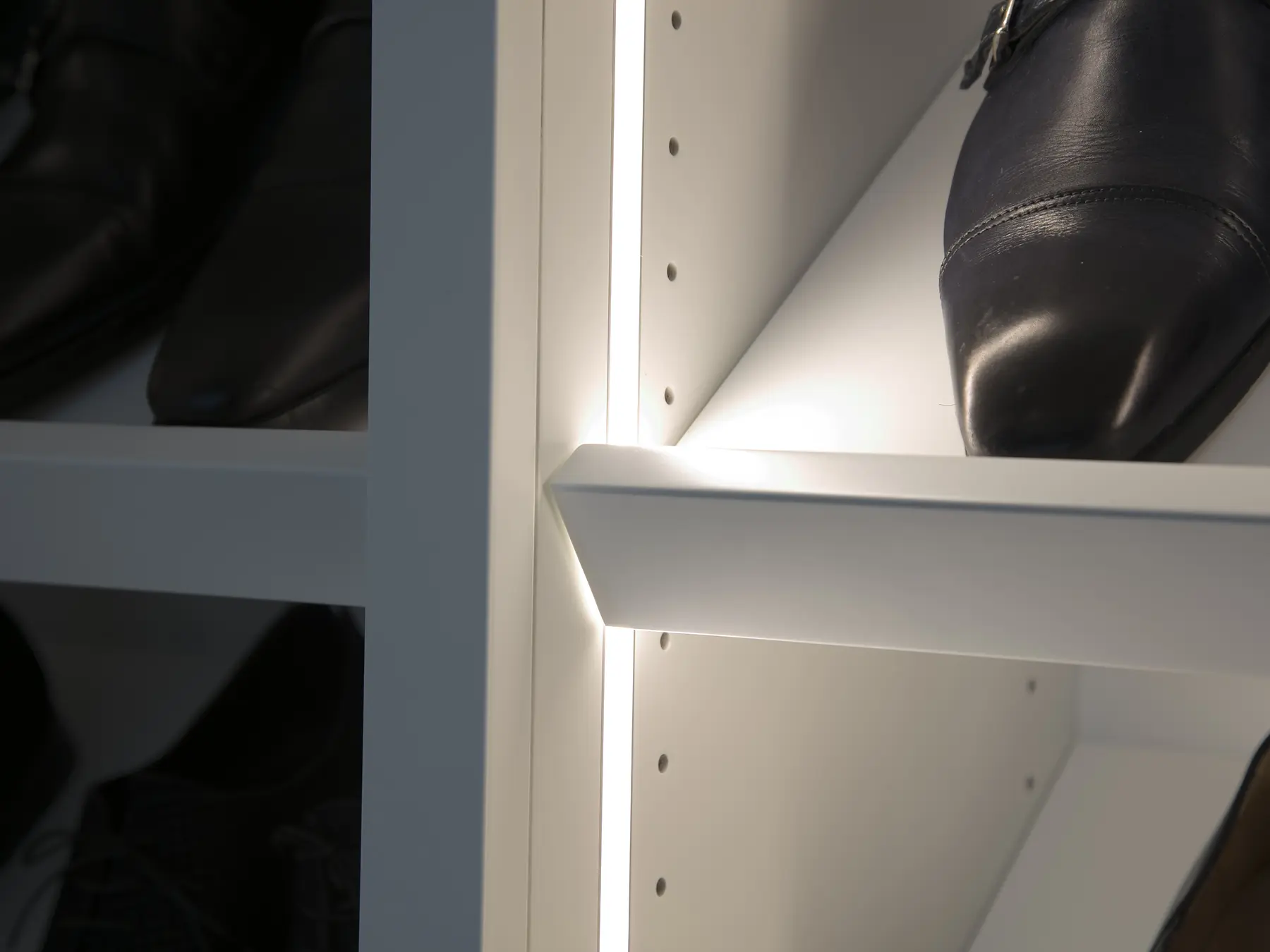 LED shelf detail in shoe-storage cabinet