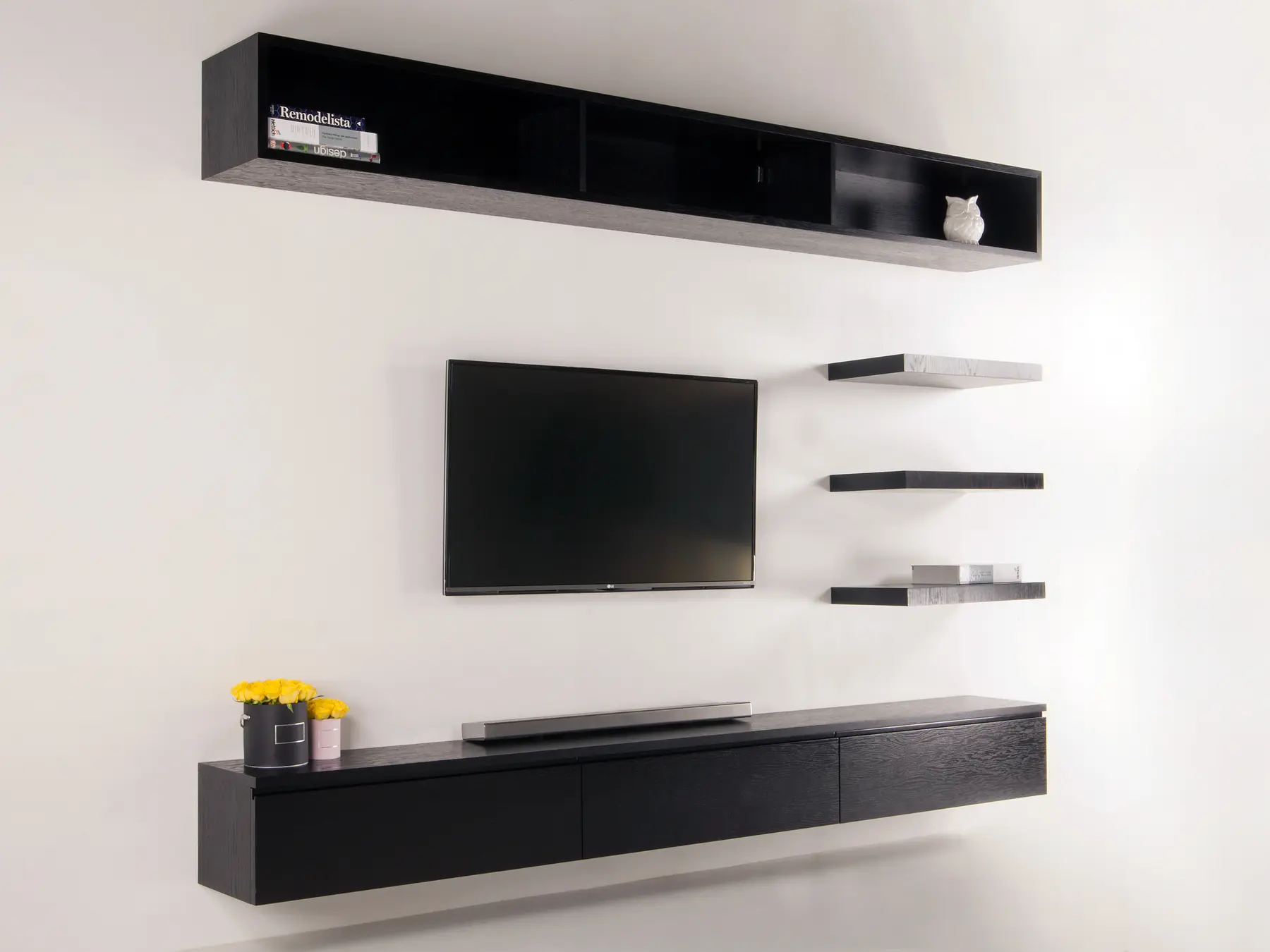 Black media wall angled view