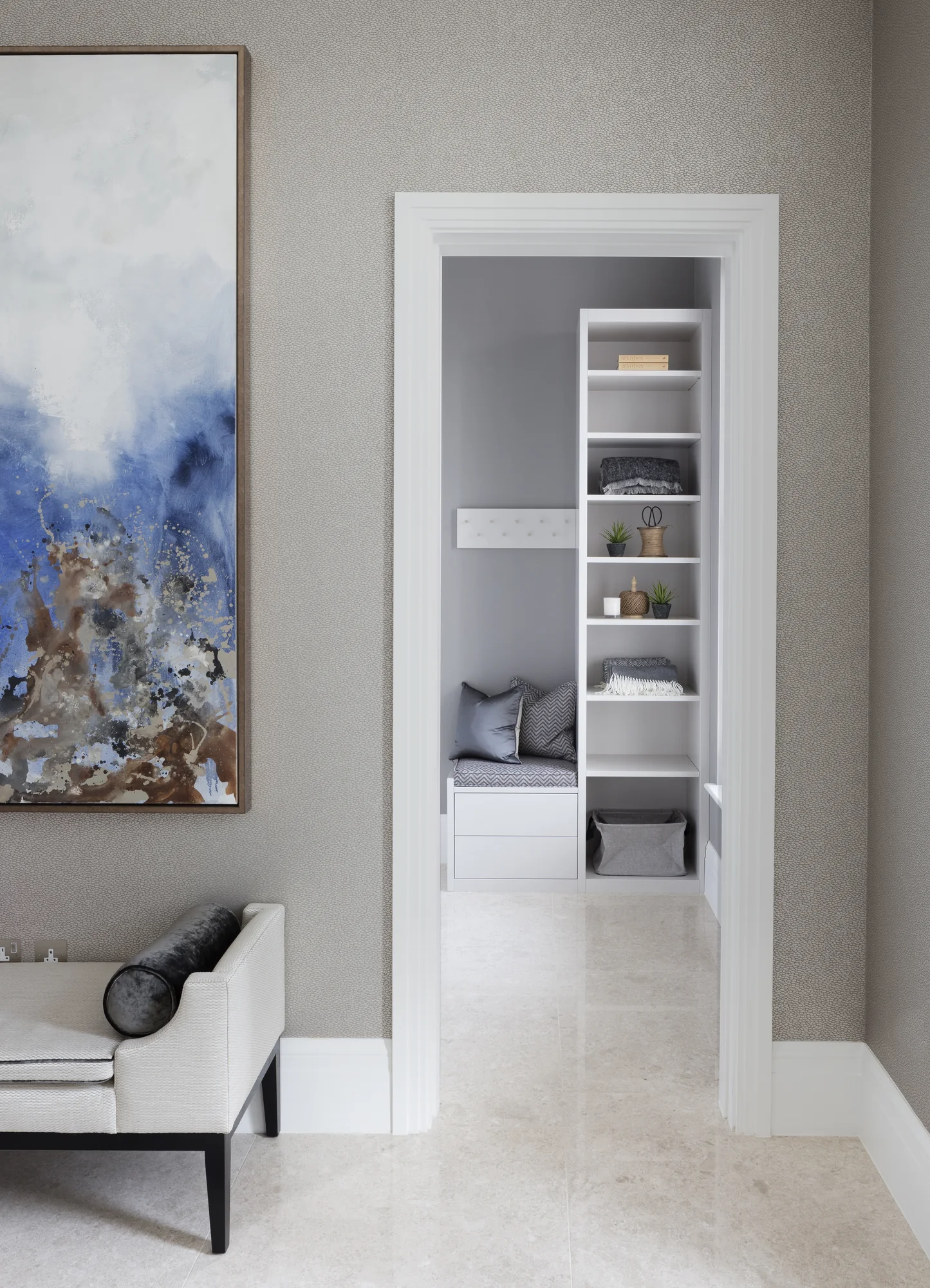 Doorway view towards the fitted hallway bench and open shelving