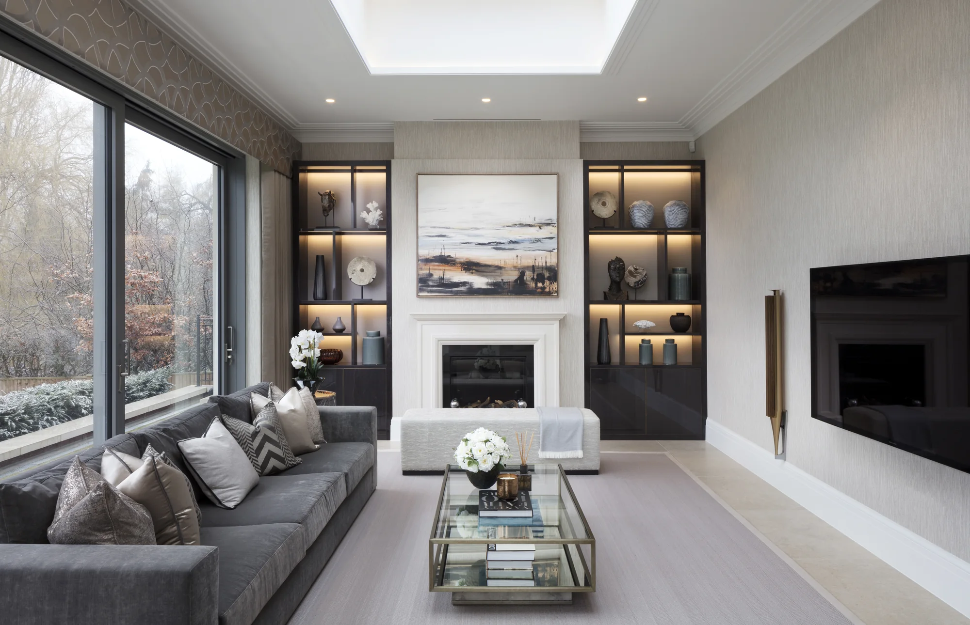 Wide living-room view of the paired fitted alcoves