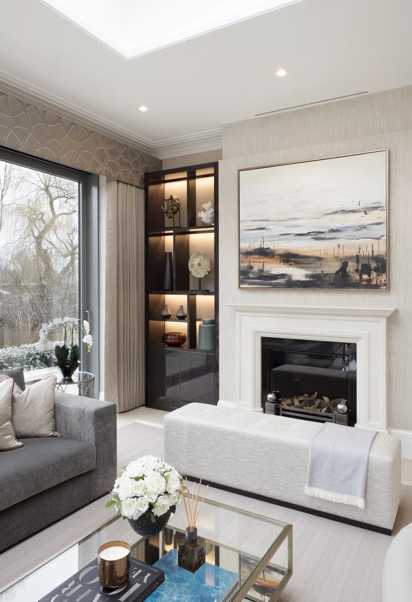 Angled view of the illuminated alcoves and fireplace