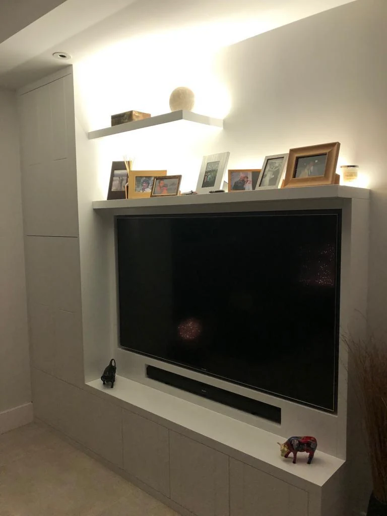 Angled view of the pale media cabinet and shelves.