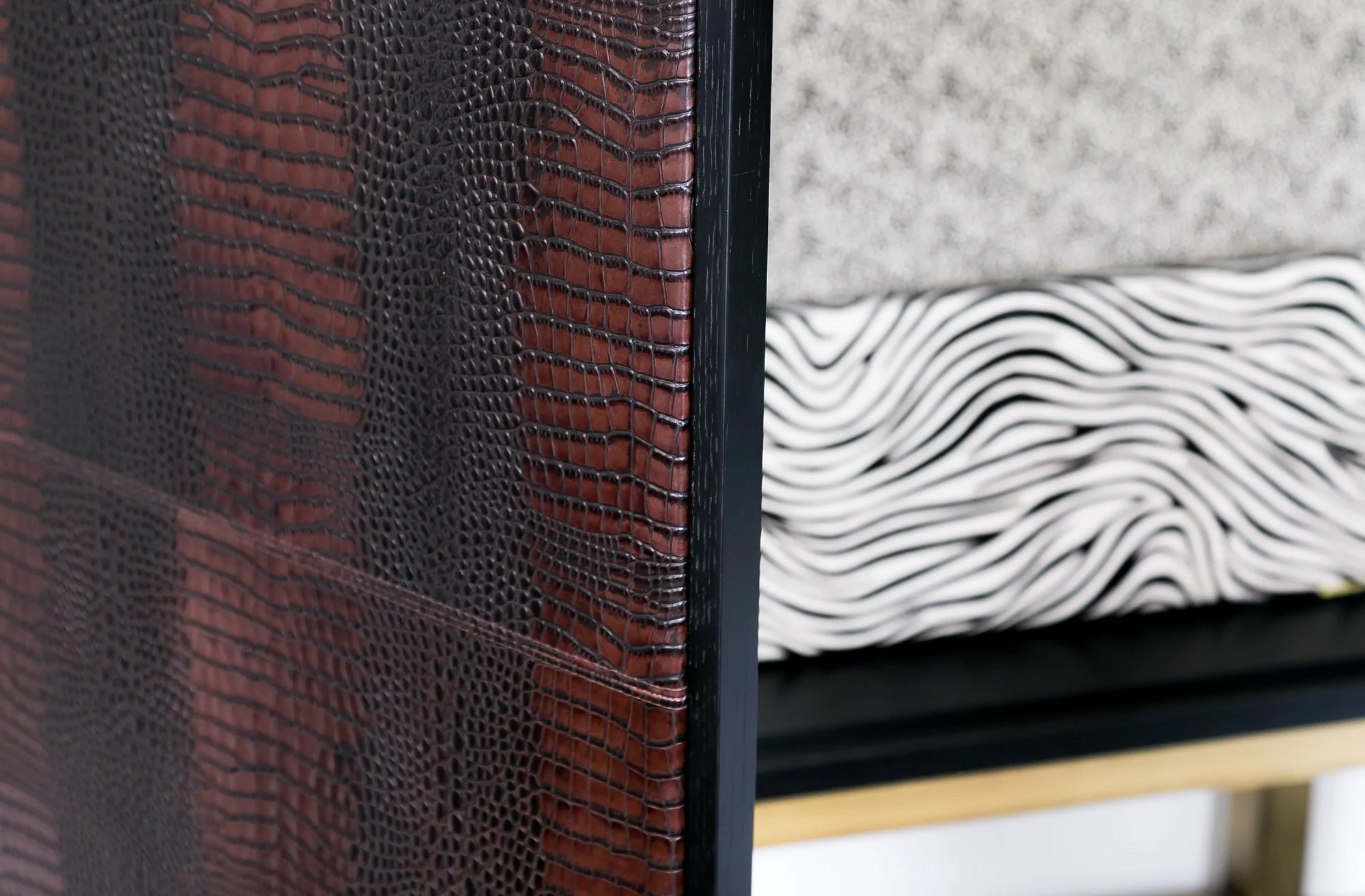 Close detail of crocodile-pattern textured cabinet front
