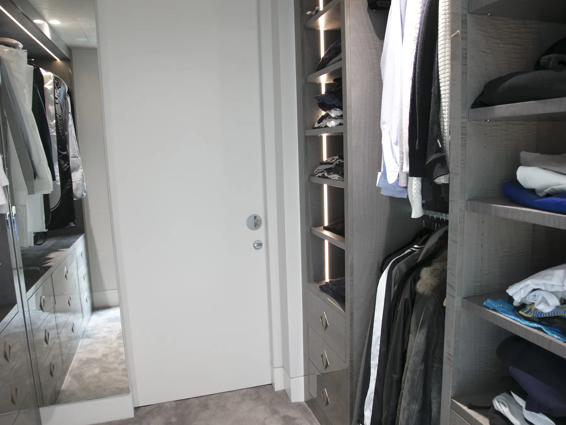 Full aisle view through walk-in wardrobe