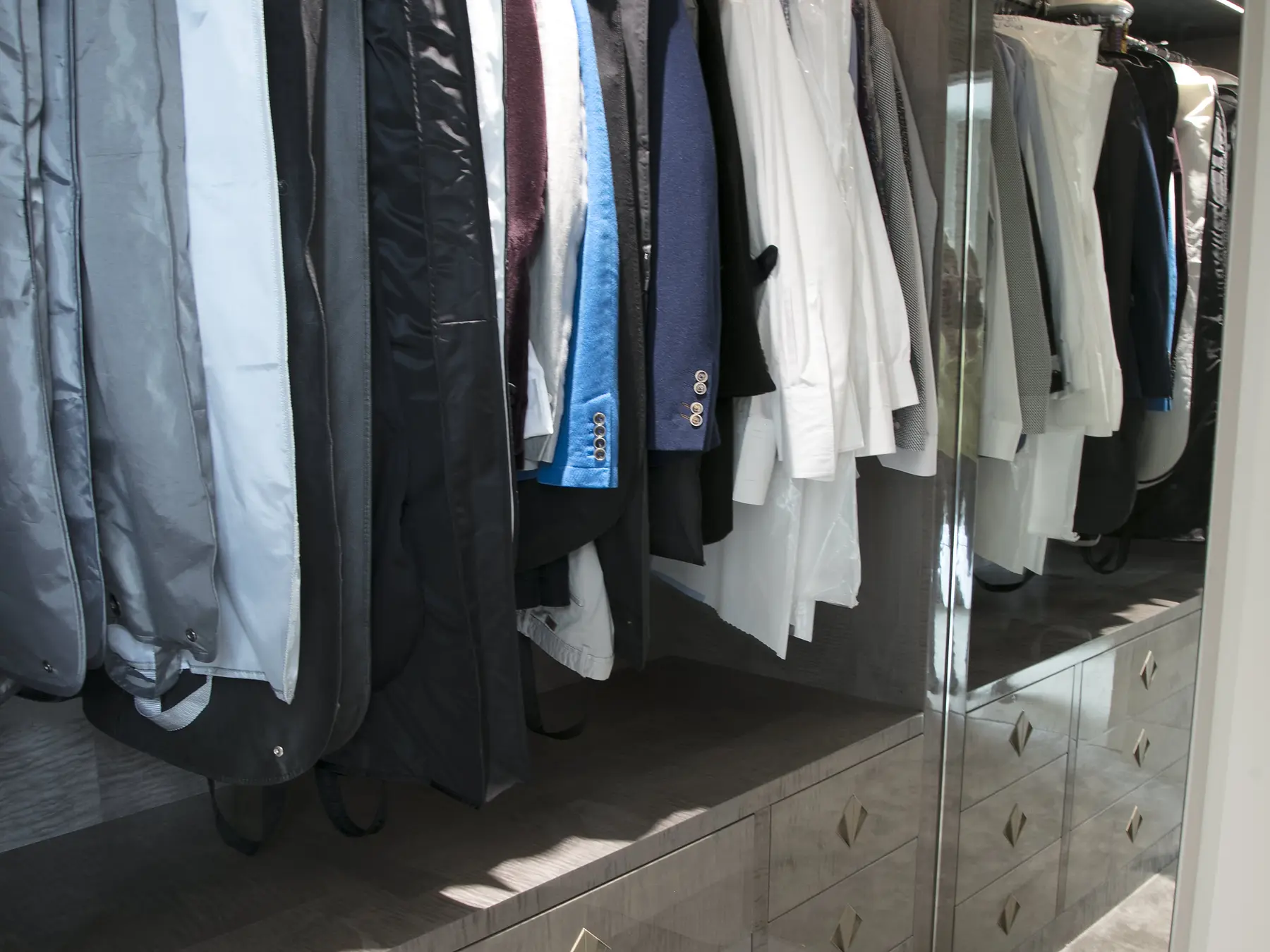 Drawer and mirror detail in walk-in wardrobe