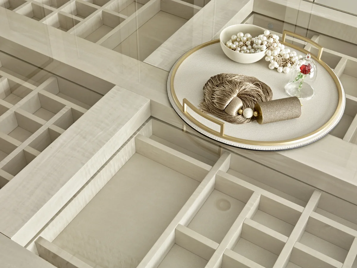 Jewellery compartments beneath the dressing island's glazed top