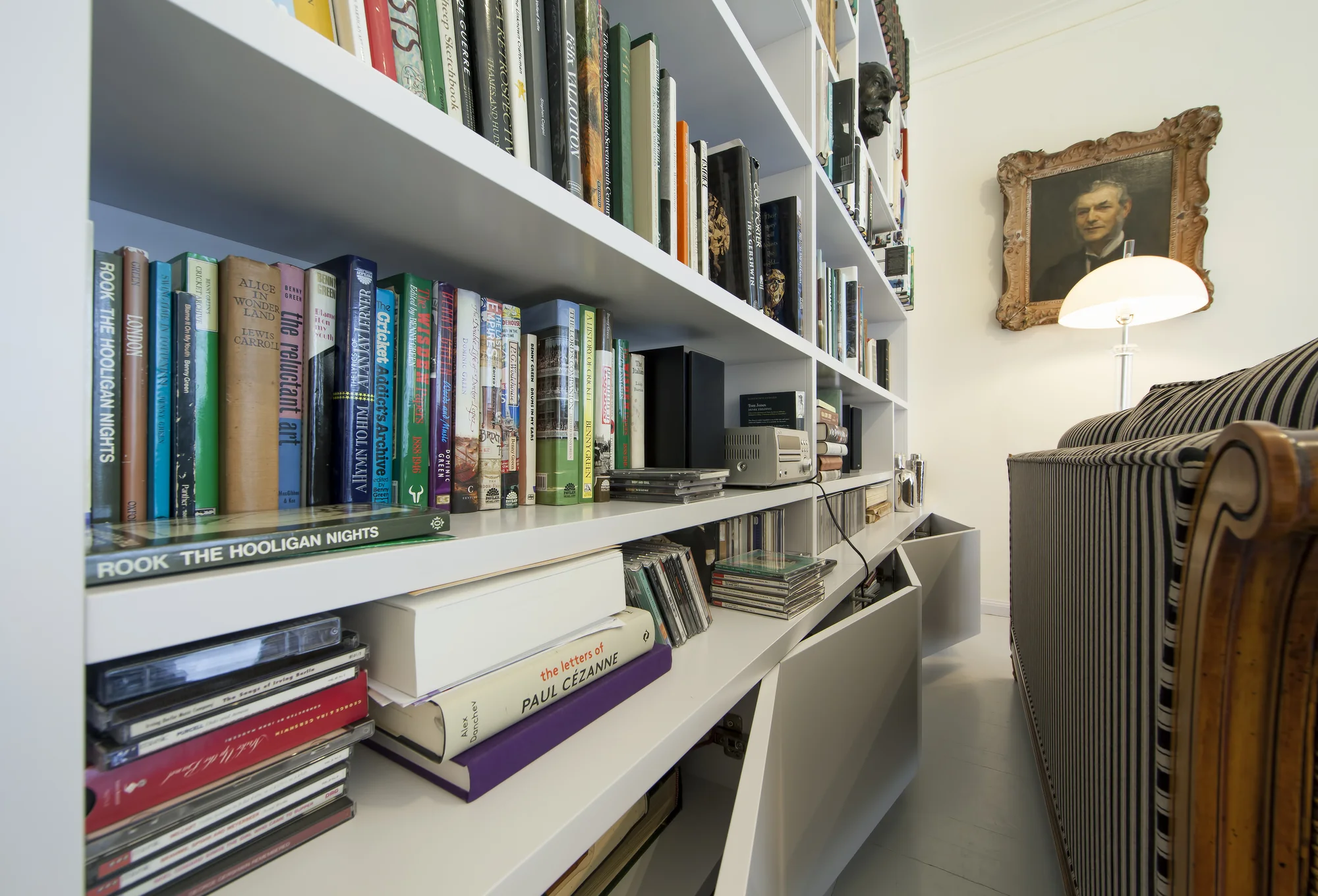 Angled view of the bookcase shelves and low-level storage