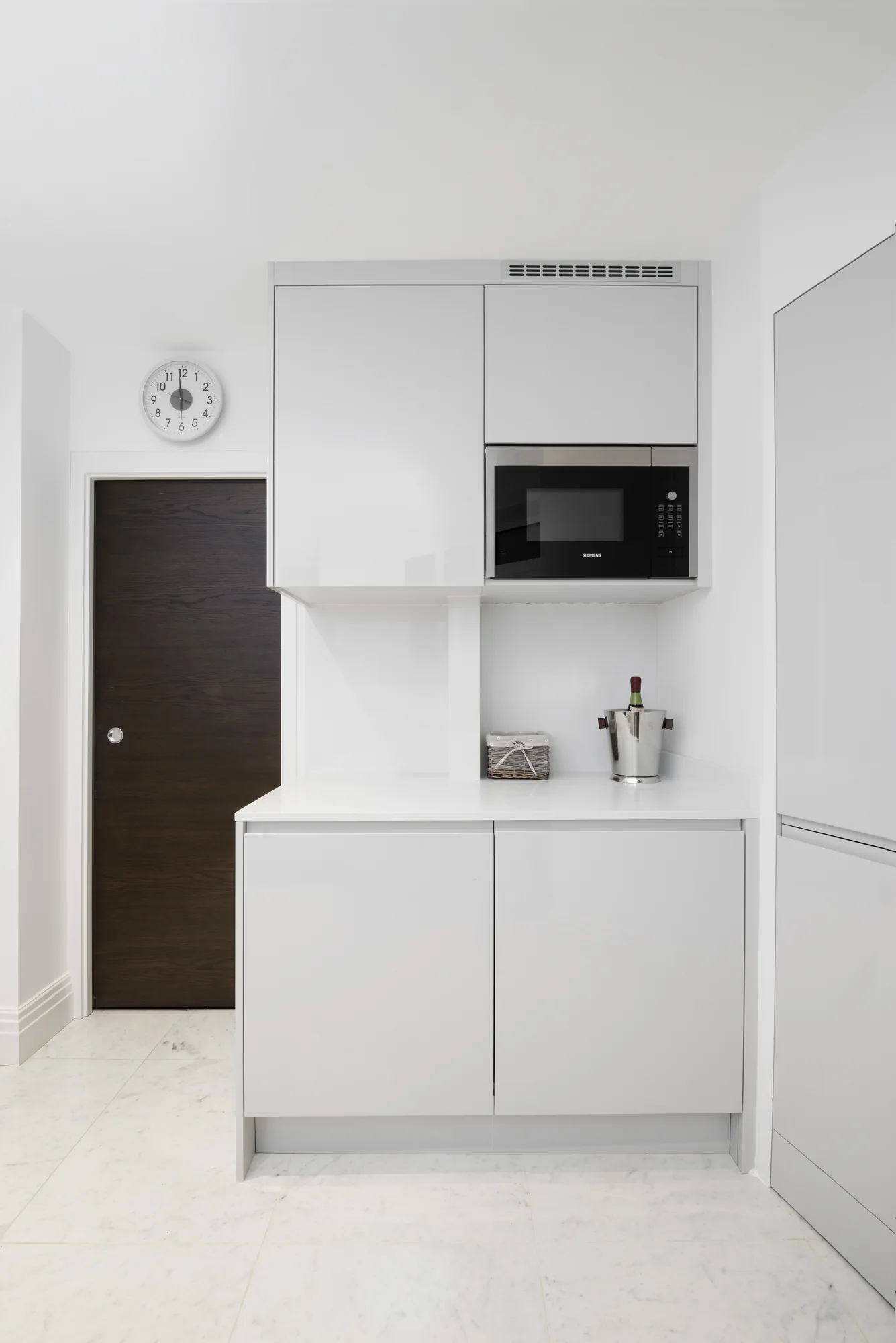 Microwave housing and matching utility cabinetry