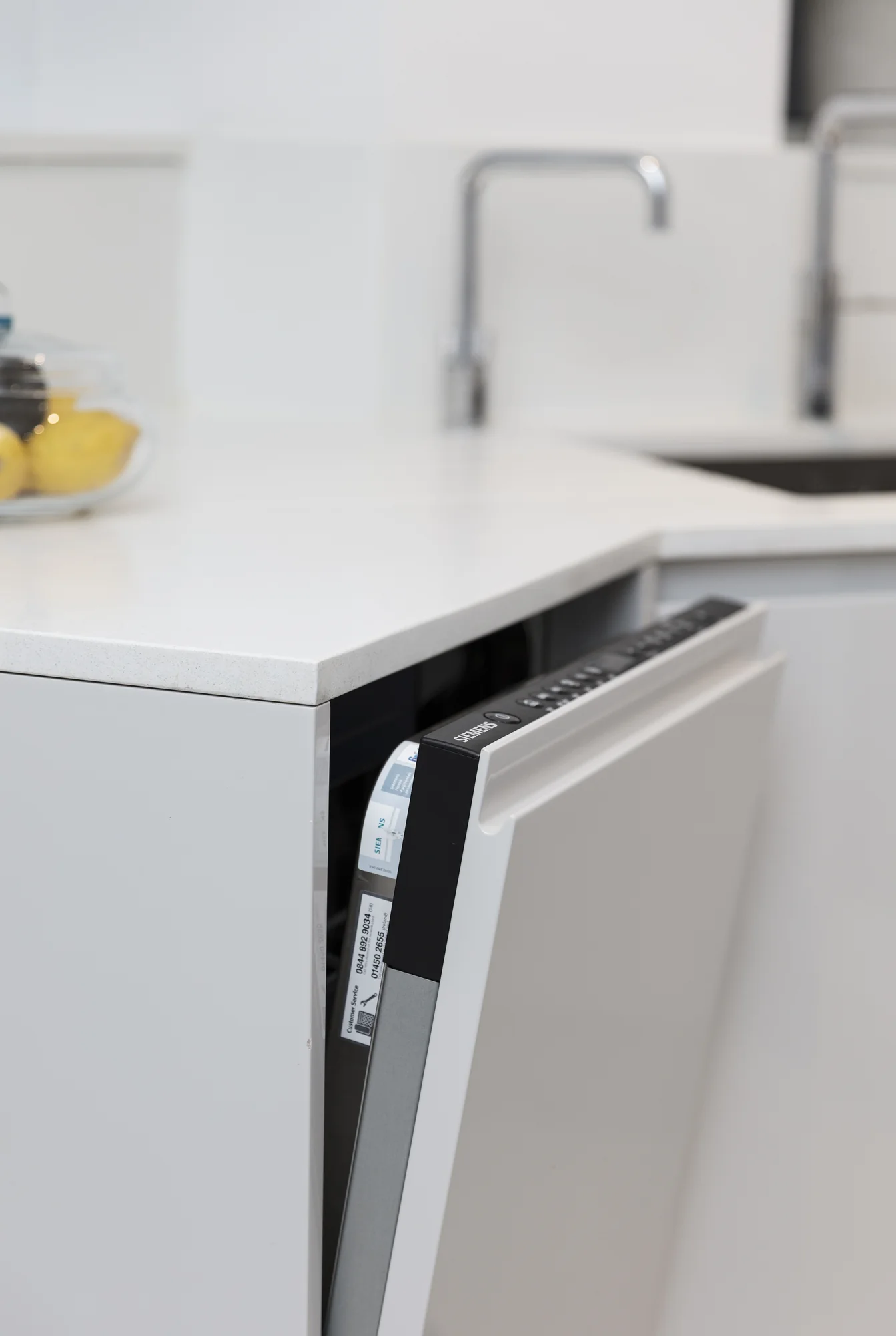 Integrated dishwasher door and fitted furniture front